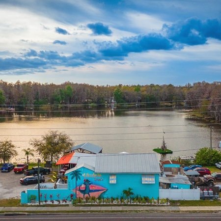 Ukulele Brand's Restaurant in Land O Lakes Florida with the lake behind the restaurant.